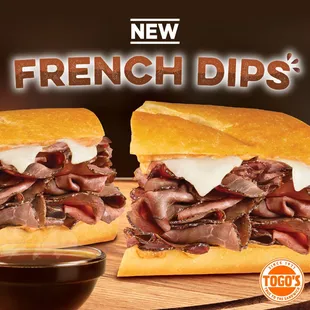 two french dips on a cutting board