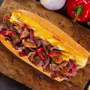 a steak sandwich on a cutting board