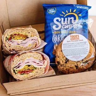 three sandwiches in a box