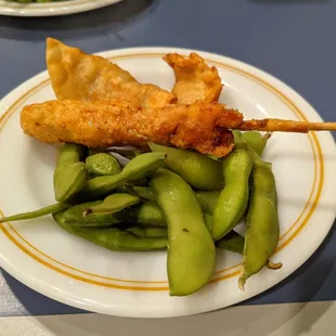 Chicken gyoza, chicken yakitori skewer, and edamame