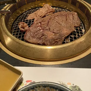 a steak on a grill