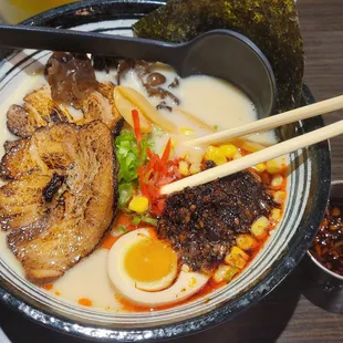 a bowl of ramen and chopsticks