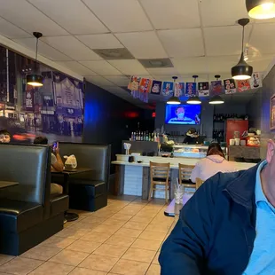 a man sitting at a table in a restaurant