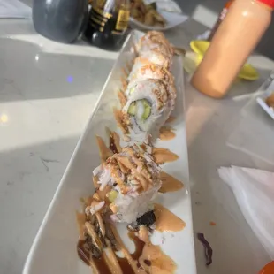 a plate of sushi and teriyaki