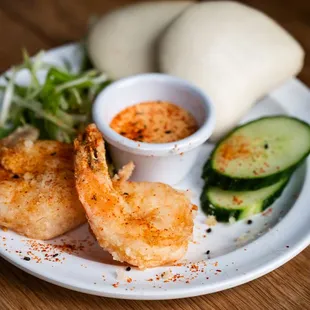 a plate of food with shrimp and vegetables