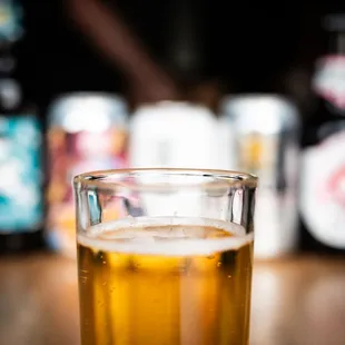 a glass of beer on a table
