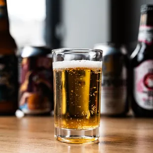 a glass of beer on a table