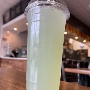 a plastic cup on a wooden table