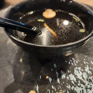 a bowl of soup with a spoon in it