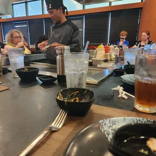 a man preparing food in a restaurant