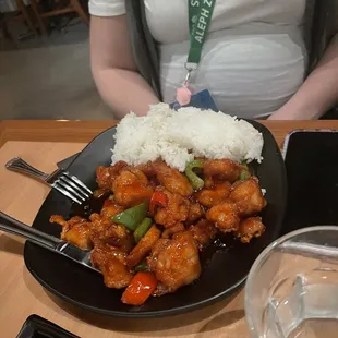 a plate of food with rice and vegetables