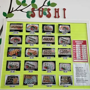 a sushi menu displayed on a wall