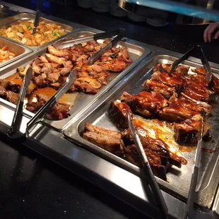 a variety of food items in a buffet