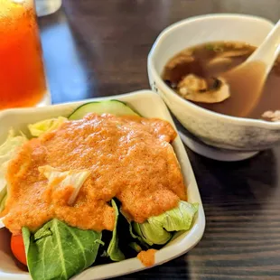 Salad with peanut dressing and mushroom soup.