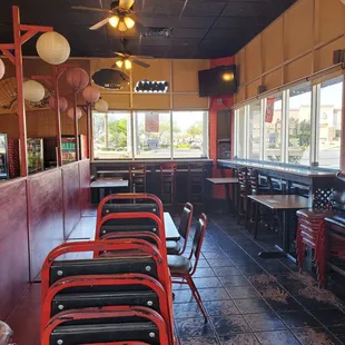 empty tables and chairs in a restaurant