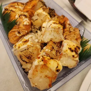 seared shrimp salmon scallop nigiri with ichimi garlic soy mayo