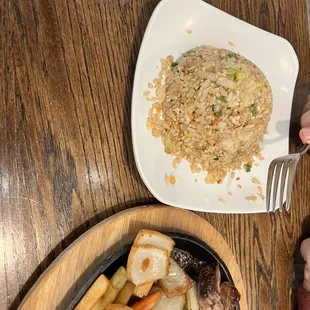 a plate of food and a bowl of rice