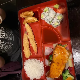 a bento box with a variety of food items