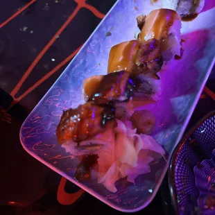 a plate of sushi on a table