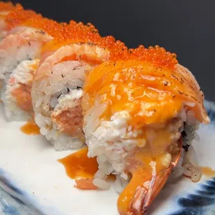 MJ Roll - (Deep fried shrimp, spicy tuna, crab mix) 5 varieties of fish, torched, spicy sauce.