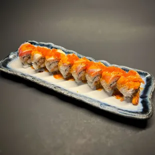 MJ Roll - (deep fried shrimp, spicy tuna, crabmix) 5 varieties of fish, torched, drizzled with spicy sauce.