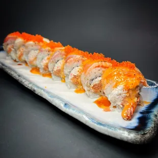 MJ Roll - (Deep fried shrimp, spicy tuna, crab mix) 5 varieties of fish, torched, spicy sauce.