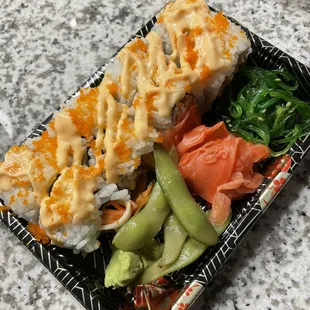 Diablo roll with wasabi, edamame, ginger, and seaweed salad