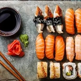 a variety of sushi and chopsticks