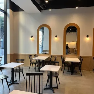 empty tables and chairs in a restaurant