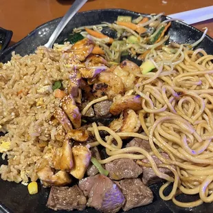NY strip, shrimp and chicken dinner with fried rice.