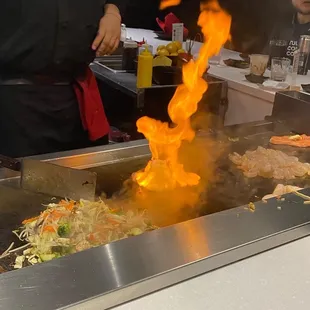 a large grill with flames coming out of it