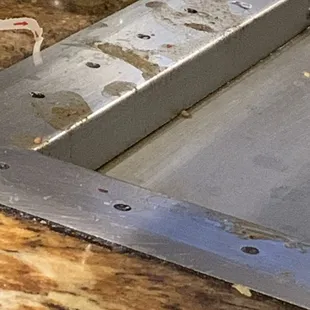 Filthy hibachi that we were sat At you can see rice on side of grill and it was never cleaned