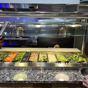 a buffet with a variety of food items