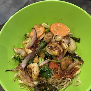 a green bowl of food