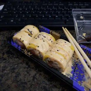 Summer roll... salmon and avacado (and cucumber) inside, mango and sweet chili sauce on top.