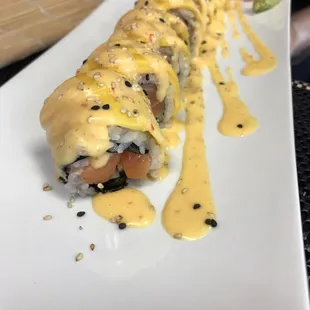 summer roll.. salmon avocado and cucumber inside of the roll, top with mango and chef special sauce! It tastes fresh.
