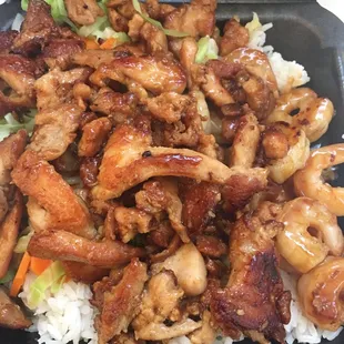 chicken and rice in a take out container