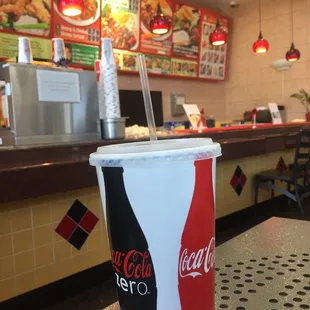 Large raspberry iced tea and counter in the background