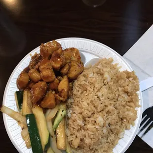 a plate of food with rice and vegetables
