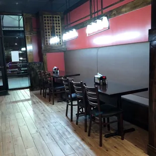 Bright lights and table/booths line one side of the restaurant. Trendy ceramic faux wood plank flooring.