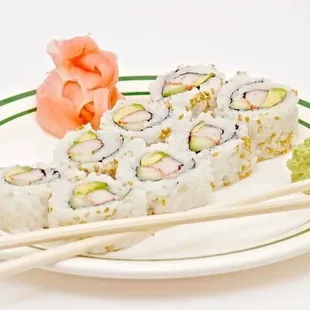 a plate of sushi and chopsticks