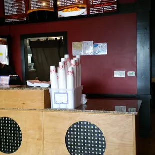 the counter and menus of the restaurant