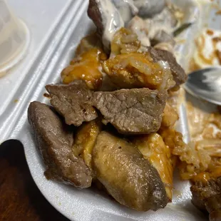 a plate of meat and rice