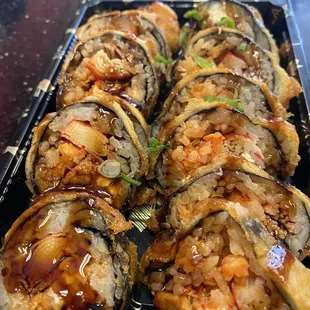 a plate of sushi rolls