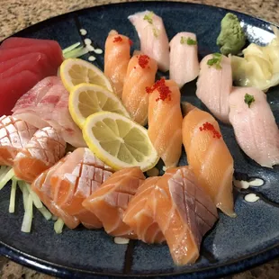 a plate of sushi and sashimi