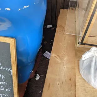 a blue barrel with a menu on it