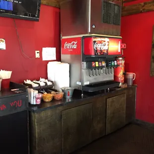 a soda dispenser and other food items