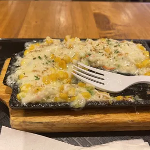 Cheese corn. Not worth the $12. Canned corn with some cheese, Lots of mayo, and celery.