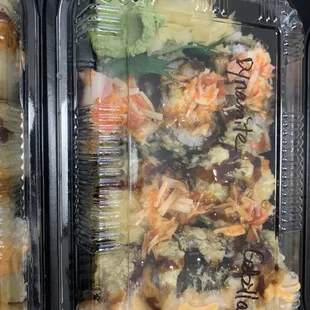 a close up of a meal in plastic containers