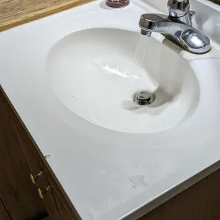 a sink with a faucet running from the faucet